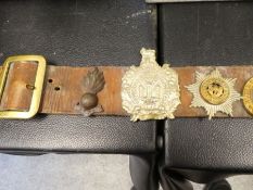 A WW2 hate belt containing 22 British regimental badges