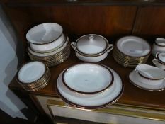 A quantity of Paragon dinnerware having maroon and gilt border