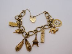 9ct yellow gold charm bracelet with heart shaped padlock clasp, hung with 8 charms, to incl. three 1