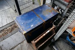 An old trunk containing tools and two other items