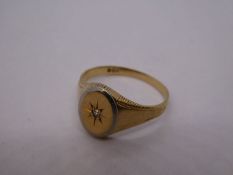 9ct yellow gold signet ring with oval panel and central diamond chip, marks worn, size L, 1.8g appro