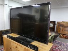 A 55" LG 3D TV with soundbar & sub woofer