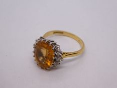 18ct gold dress ring, with large oval Topaz flanked 3 graduating diamonds both sides, weight 5.3g ap