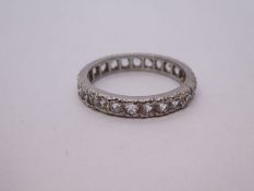 18ct white gold eternity ring inset with clear stones, size Q, 4.1g approx