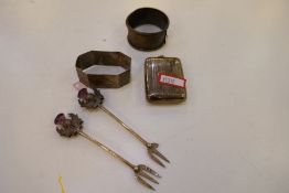 A lot of silver items comprising napkin rings, hip flask AF, and two decorative cake forks, Edwardia