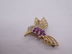 9ct yellow gold brooch in the form a Bird set with rubies to breast and diamonds to to eye, marked 3