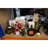A collection of various bottles including Armagnac, Grand Marnier, Bells Whisky, Austria Rum, Asbach