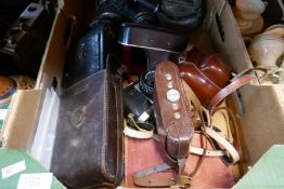 A box of vintage cameras including Praktica, Voigtlander, Kodak, etc plus a compass