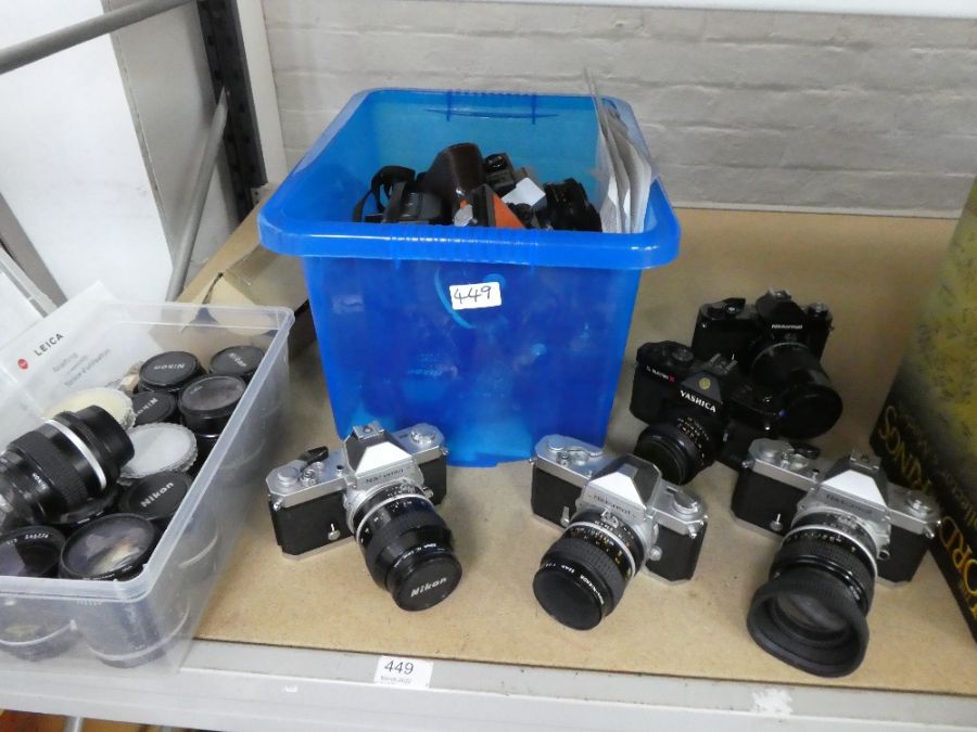 A quantity of vintage SLR cameras including numerous Nikkormat models, a quantity of Nikon lenses an