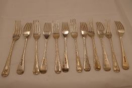 Twelve silver Victorian forks with ornate, engraved design handles. Four hallmarked London 1863, Cha