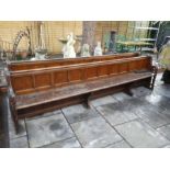 A pair of old Church pews having panelled backs, 316cm