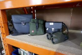 A selection of binoculars, some cased, some Fujinon, including Leica