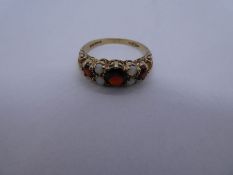 9ct yellow gold garnet and opal dress ring, marked 375, JM Co, size Q, 2.4g approx. Gold content val