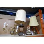 A selection of lamps and ceiling lights of various materials, including ceramic wood and brass