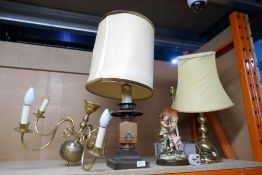 A selection of lamps and ceiling lights of various materials, including ceramic wood and brass