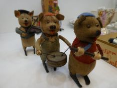 Schuco; three vintage clockwork pig musicians