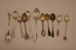 A quantity of silver and white metal collector's spoons, some Canadian, Danish, etc, of intricate an