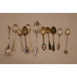 A quantity of silver and white metal collector's spoons, some Canadian, Danish, etc, of intricate an