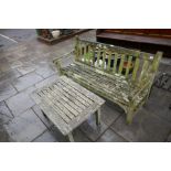 A teak garden bench and an oblong teak table