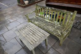 A teak garden bench and an oblong teak table