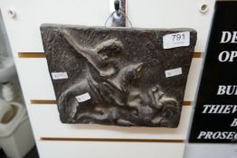 A clay plaque depicting George slaying The Dragon, medieval in style