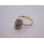 Pretty 14K yellow gold cocktail ring with two flowerheads encased with diamonds, size M, marked 14K.