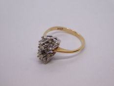 Pretty 14K yellow gold cocktail ring with two flowerheads encased with diamonds, size M, marked 14K.