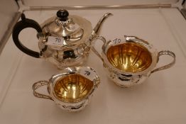 An exceptional silver and gilt Edwardian tea service of very high quality and design. On raised pede