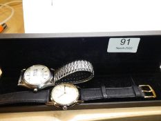 A vintage gents Roamer watch winds and ticks,accompanied by a Seiko gents watch both stainless