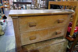 An antique oak cottage dining table and a two drawer chest