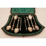 A Victorian cased set of silver Apostle spoons and marking tongs. Decorative pierced handles hallmar