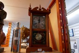 A modern/ retro wooden cased 31 day pendulum clock