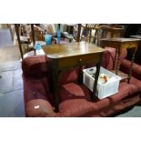 An antique oak side table having one drawer on square chamfered legs and a barley twist table