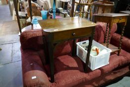 An antique oak side table having one drawer on square chamfered legs and a barley twist table