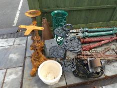 A pair of cast iron pub table bases, a metal stick stand and sundry