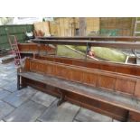 Two old Church pews, having panelled back with raised book shelf, 316cm