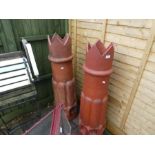 A pair of large chimney pots having fluted decoration, 118cm