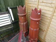 A pair of large chimney pots having fluted decoration, 118cm