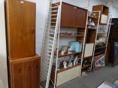 Ladderax; a quantity of 1970s adjustable shelving with cupboard and drawers on white metal ends