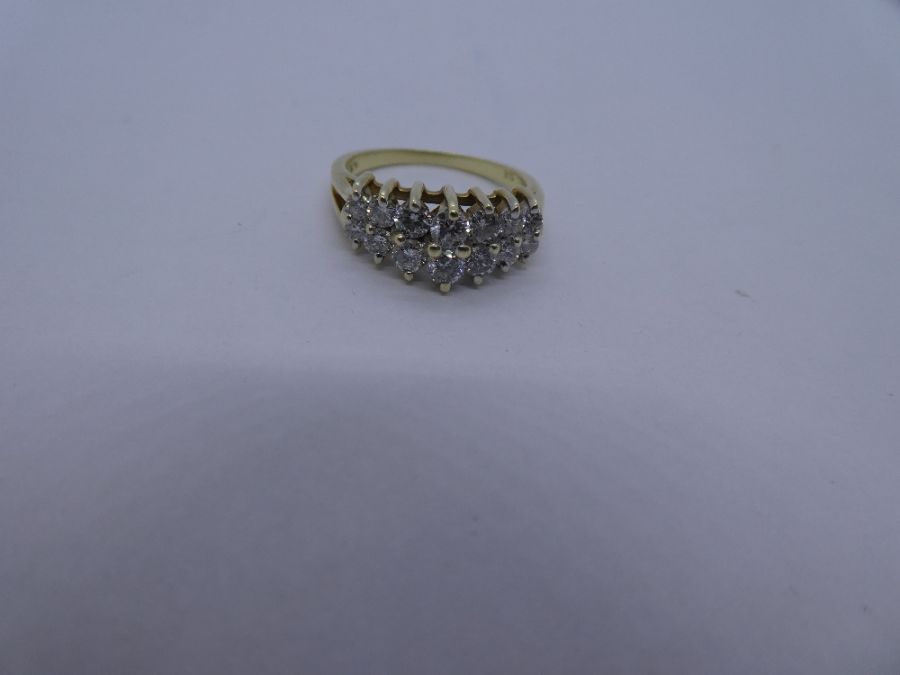 14K yellow gold ring with two raised rows graduating diamonds, marked 14K Size N/O; 4.4g approx - Image 2 of 3