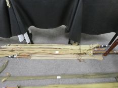 A quantity of vintage split cane fishing rods, and others