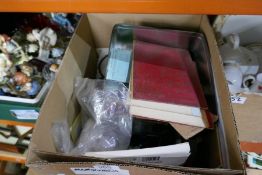 A box of various collectables including stamps, ephemera, cigarette cards, etc