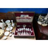 A canteen of Kings pattern cutlery and Capodimonte figure