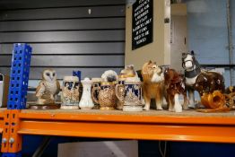 A large selection of teapots including horse figures, Beswick, steins, etc