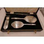 A cased WI Broadway and Co dressing table set, hallmarked Birmingham 1962. Engine turned and engrave