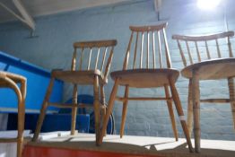 A pair of Ercol stick back chairs and four other kitchen chairs