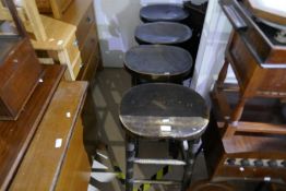 A set of four beech bar stools