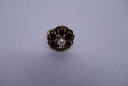 9ct yellow gold garnet and pearl dress ring in the form of a flower head, AF, one garnet missing, Si