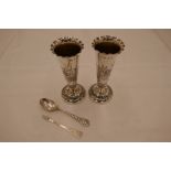 A beautiful pair of Victorian silver spill vases, with decorative raised pedestal, circular foot and