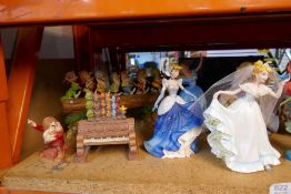 A selection of large and small Disney figures, mostly depicting Princesses